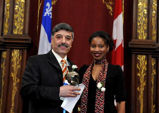 Professor Masoud Farzaneh receives the Charles Biddle Prize from Yolande James, Quebec Minister of Immigration